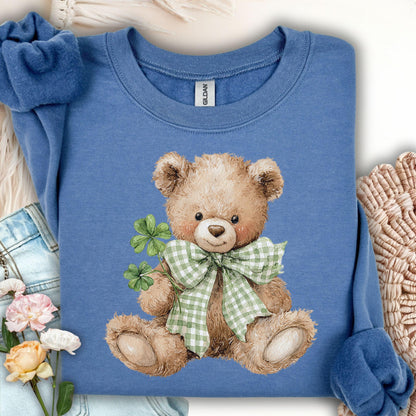 Indigo blue sweatshirt with a watercolor teddy bear holding four-leaf clovers and wearing a shamrock bow.