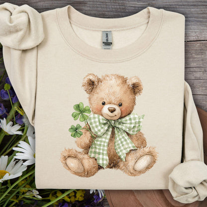 Sand S sweatshirt with watercolor teddy bear holding shamrocks and wearing a green gingham bow.