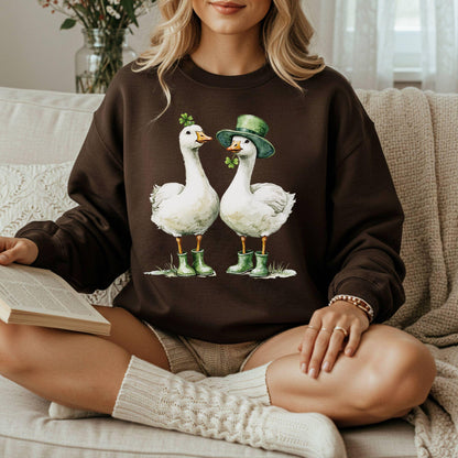 Brown sweatshirt with two St. Patrick's Day geese in green boots, one with a shamrock, one with a leprechaun hat.