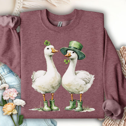 Heather Sport Dark Maroon sweatshirt with two geese in St. Patrick's Day attire, one with a shamrock, one with a leprechaun hat.