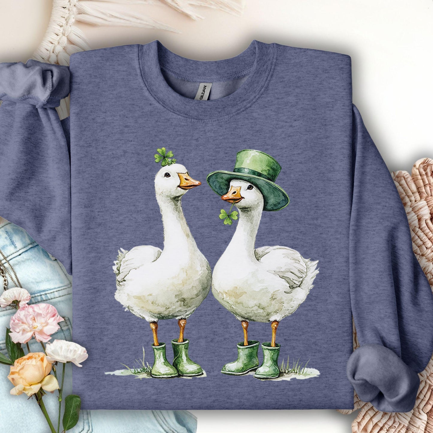 Heather Sport Dark Navy sweatshirt with two white geese in green boots, one with a shamrock, the other a leprechaun hat.