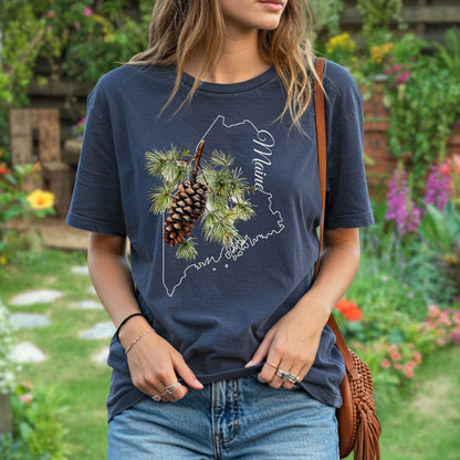 Relaxed-fit, garment-dyed navy t-shirt with a pine cone and Maine outline graphic.