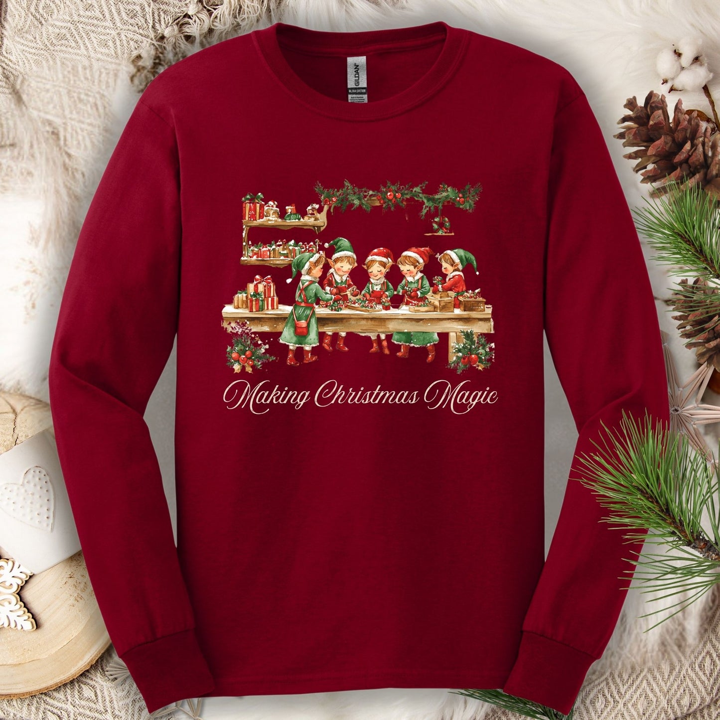 Cardinal Red long sleeve tee with vintage elves in Santa's workshop and "Making Christmas Magic" text.