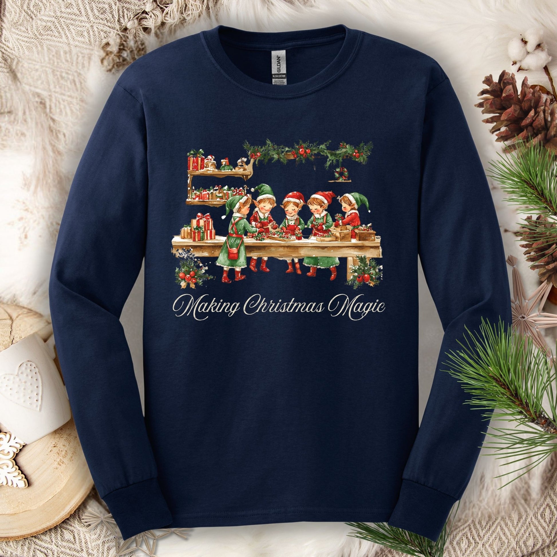 Navy long sleeve tee with vintage Santa's workshop and elves, "Making Christmas Magic" text.