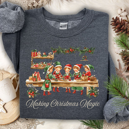 Dark Heather S sweatshirt with vintage Santa's workshop, elves, and "Making Christmas Magic" design.