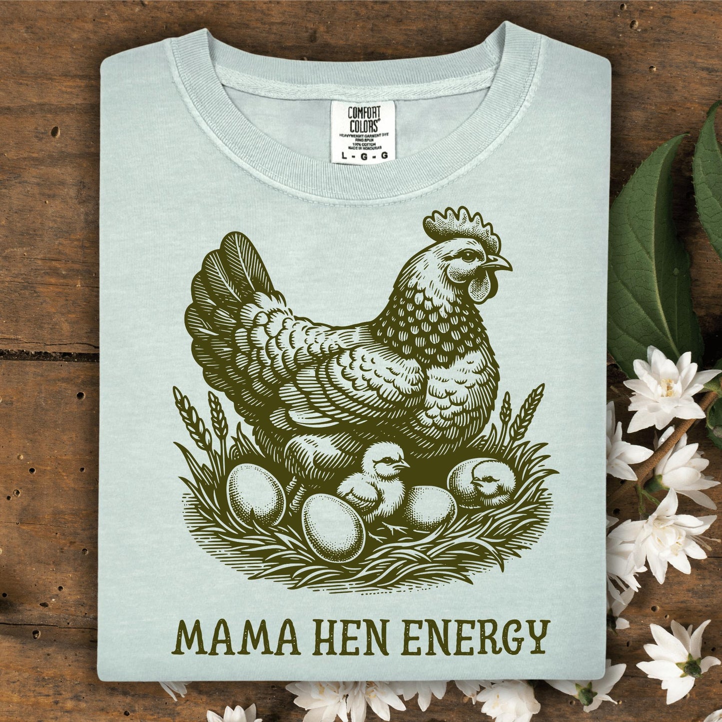 Bay Comfort Colors t-shirt with a vintage hen, chicks, eggs, and "Mama Hen Energy" text.