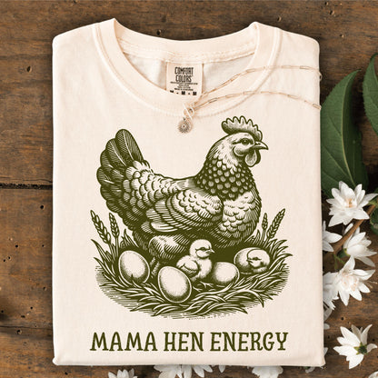 Ivory Comfort Colors t-shirt with a vintage green hen, chicks, eggs, and "Mama Hen Energy" text.