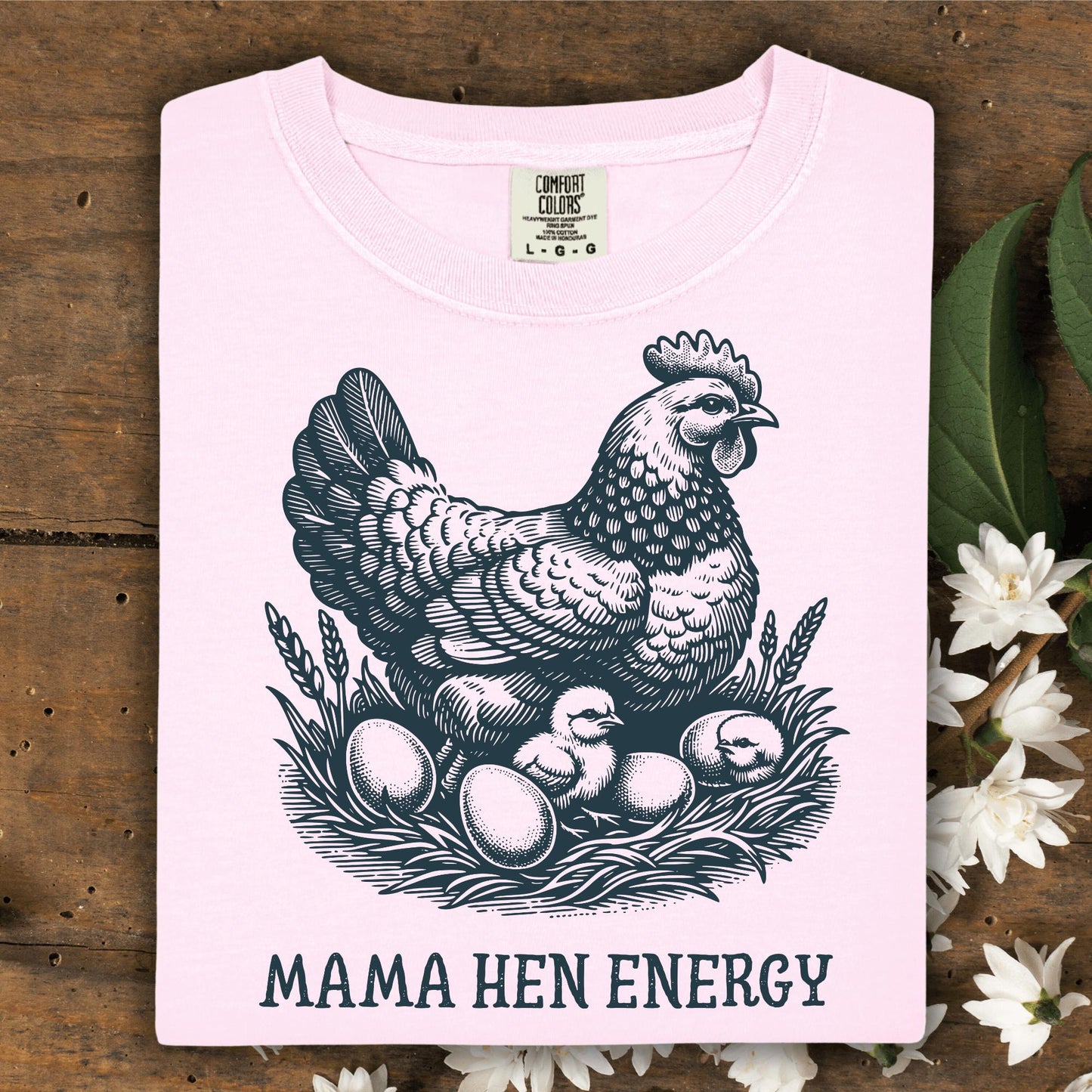 Blossom pink Comfort Colors t-shirt with a vintage hen, chicks, and "Mama Hen Energy" graphic.
