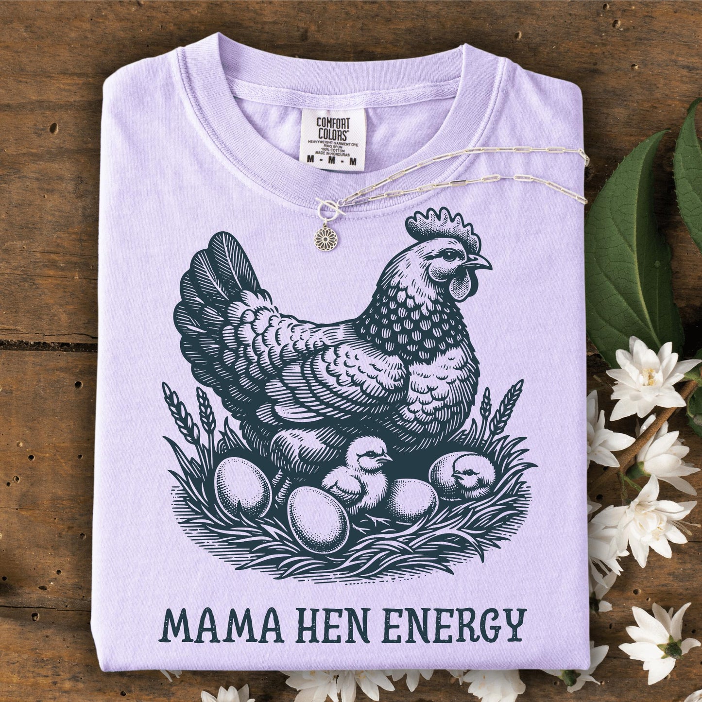Orchid Comfort Colors t-shirt with vintage hen, chicks, eggs, and "Mama Hen Energy" text.