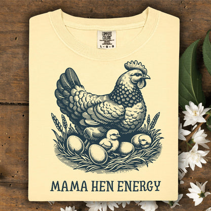 Butter yellow Comfort Colors tee with vintage hen, chicks, eggs, and "Mama Hen Energy" text.