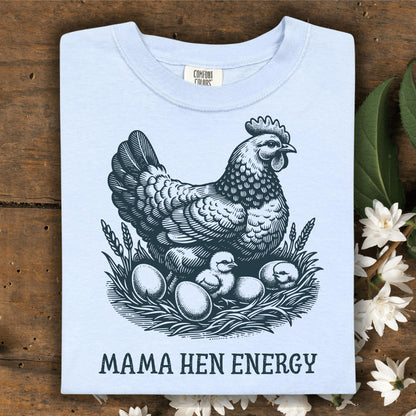 Hydrangea Comfort Colors t-shirt with a vintage hen, chicks, and eggs graphic, plus "MAMA HEN ENERGY" text.