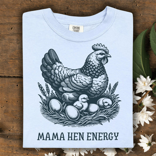 Hydrangea Comfort Colors t-shirt with a vintage hen, chicks, and eggs graphic, plus "MAMA HEN ENERGY" text.