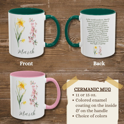 White ceramic mug with daffodil and cherry blossom design, "March" text, and green or pink interior/handle.