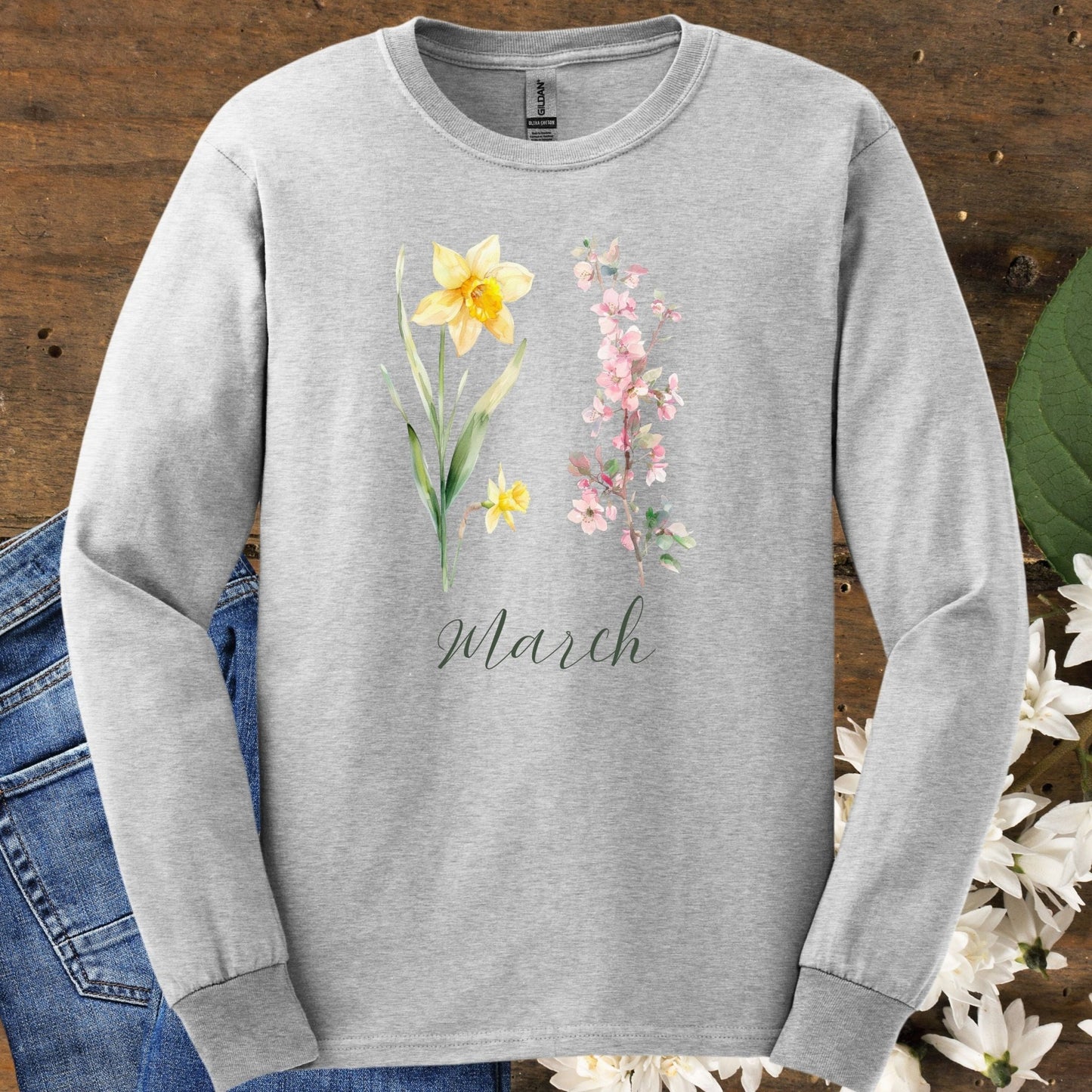 Ash gray long sleeve tee with hand-drawn daffodil, pink cherry blossoms, and "March" script.