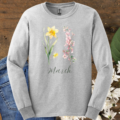 Ash gray long sleeve tee with hand-drawn daffodil, pink cherry blossoms, and "March" script.