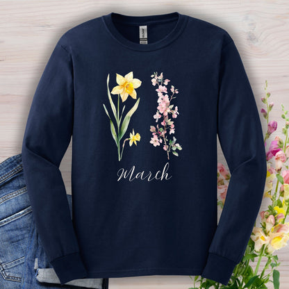 Navy long sleeve tee with hand-drawn yellow daffodils, pink cherry blossoms, and "March" script.