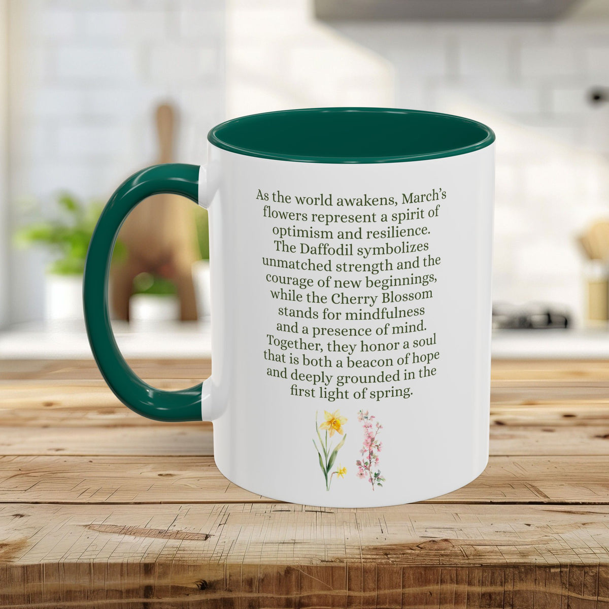 White ceramic mug with dark green handle and interior, featuring March birth flower text and daffodil/cherry blossom art.