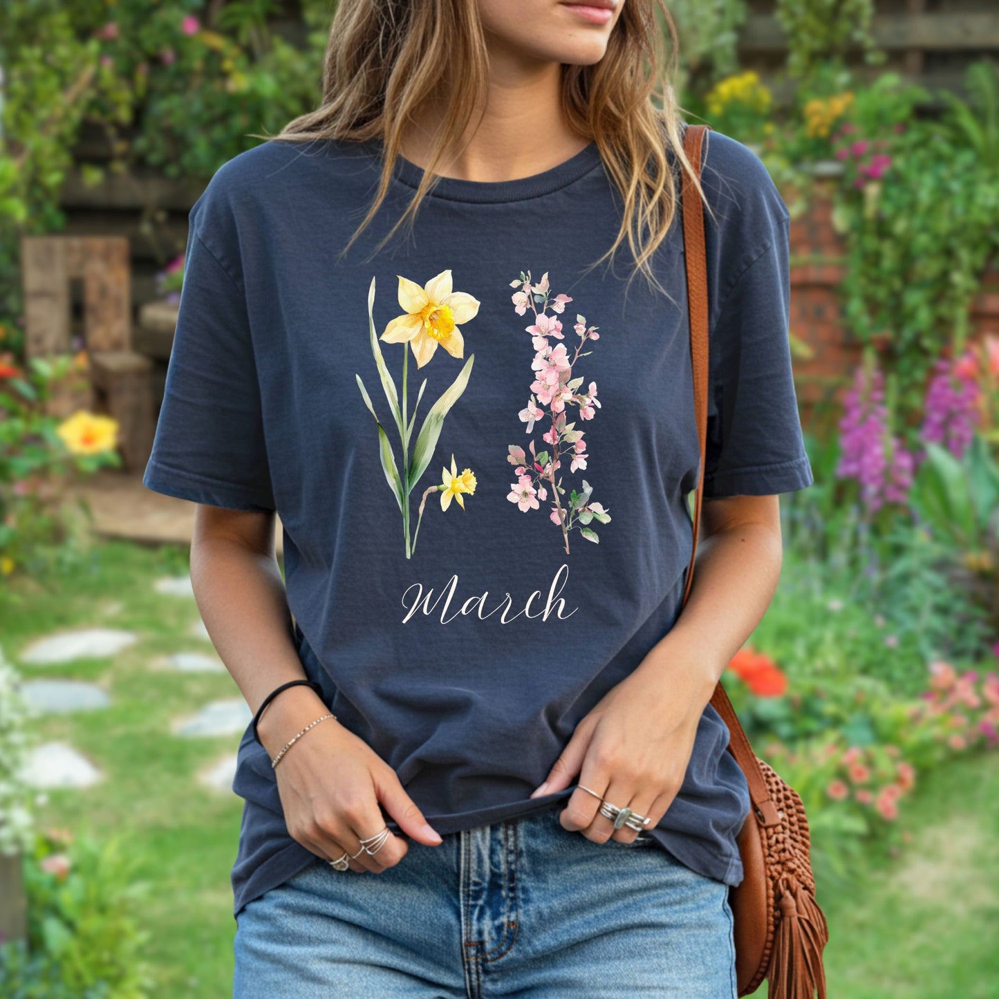 Relaxed-fit, garment-dyed navy t-shirt with daffodil, cherry blossom, and "March" script.