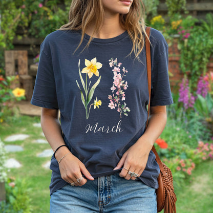 Relaxed-fit, garment-dyed navy t-shirt with daffodil, cherry blossom, and "March" script.