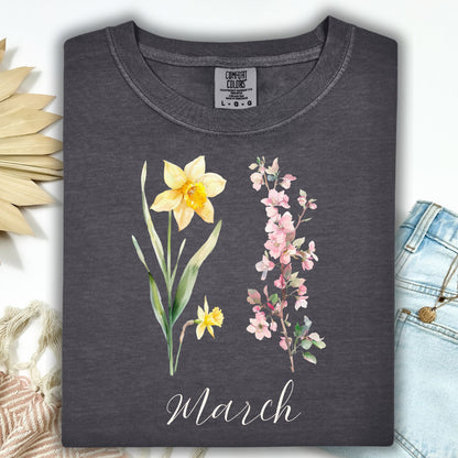 Pepper S t-shirt with watercolor daffodil, cherry blossoms, and "March" script.