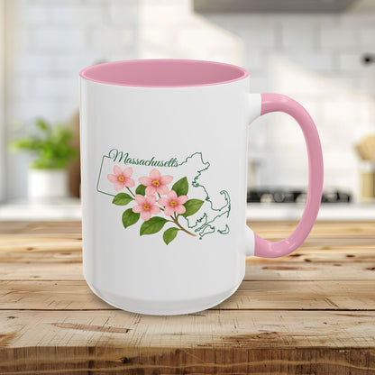 15oz white ceramic mug with pink interior/handle, featuring a watercolor Mayflower and Massachusetts state outline.