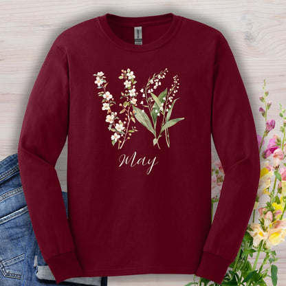 Maroon long sleeve tee with watercolor lily of the valley and hawthorn blossoms, and "May" script.