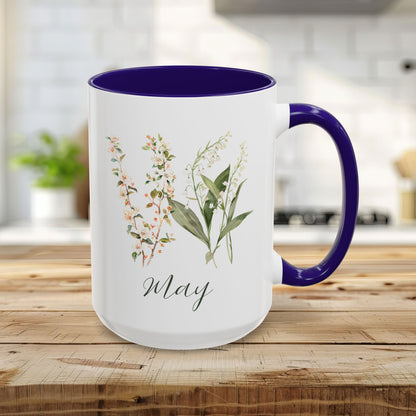 15oz white ceramic May birth month flower mug with navy blue handle and interior, featuring watercolor lily of the valley.