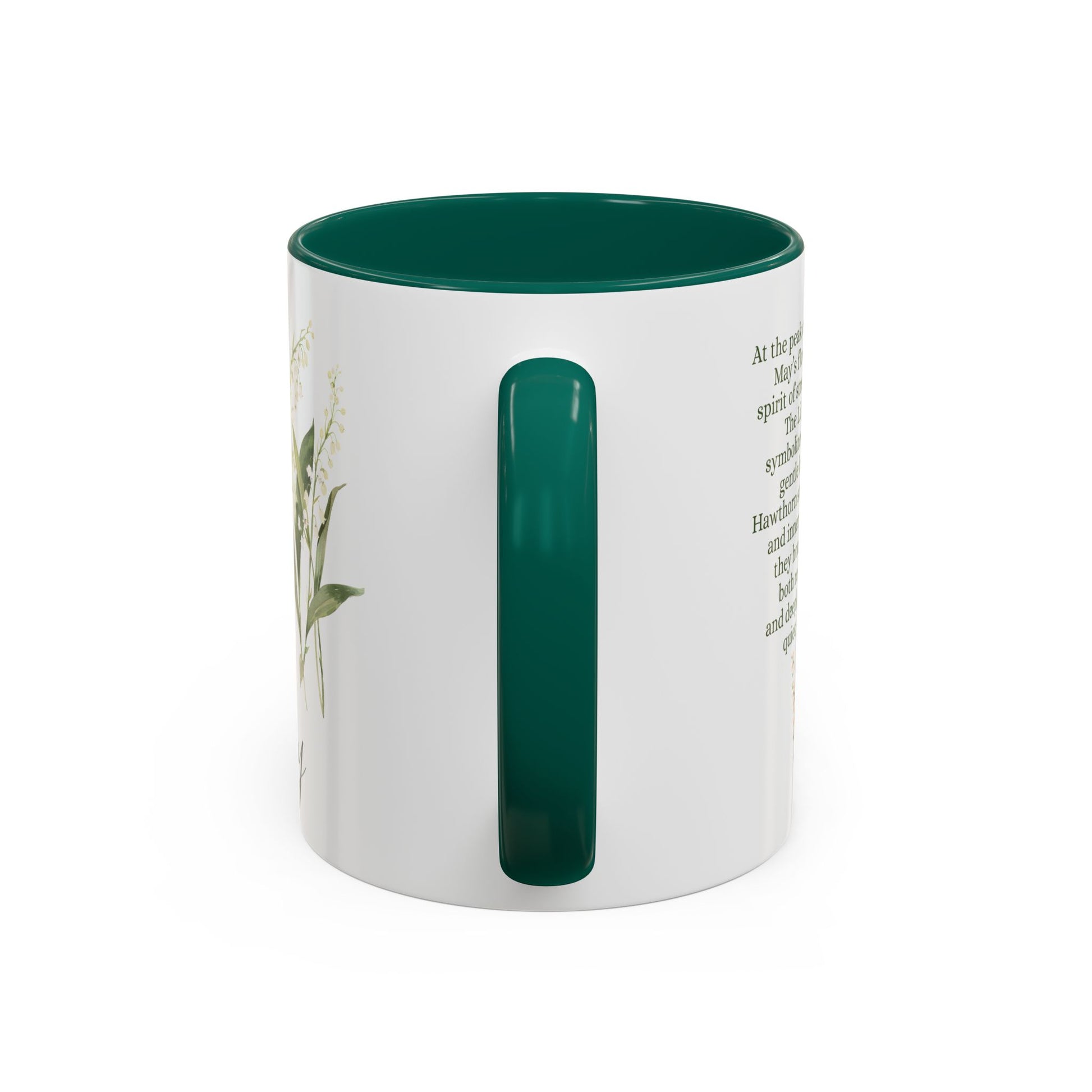 White ceramic mug with a dark green handle and interior, featuring a delicate May birth month flower design.