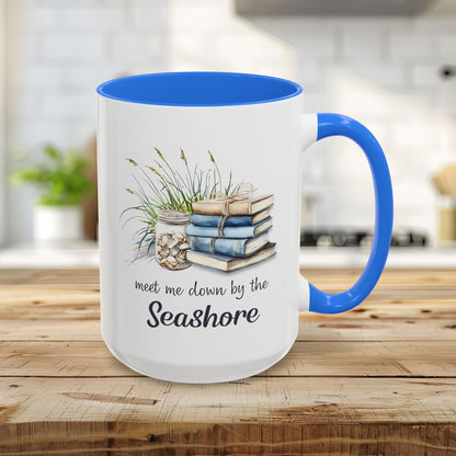 15oz white ceramic mug with Cambridge Blue interior/handle, featuring watercolor books, grasses, shells, and "meet me down by the Seashore.