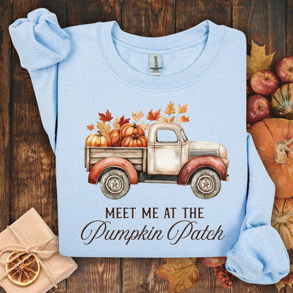 Light blue Gildan sweatshirt with a vintage truck, pumpkins, and "Meet Me at the Pumpkin Patch" text.