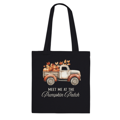 Black tote bag with vintage beige pickup truck, pumpkins, fall leaves, and "Meet Me at the Pumpkin Patch" text.