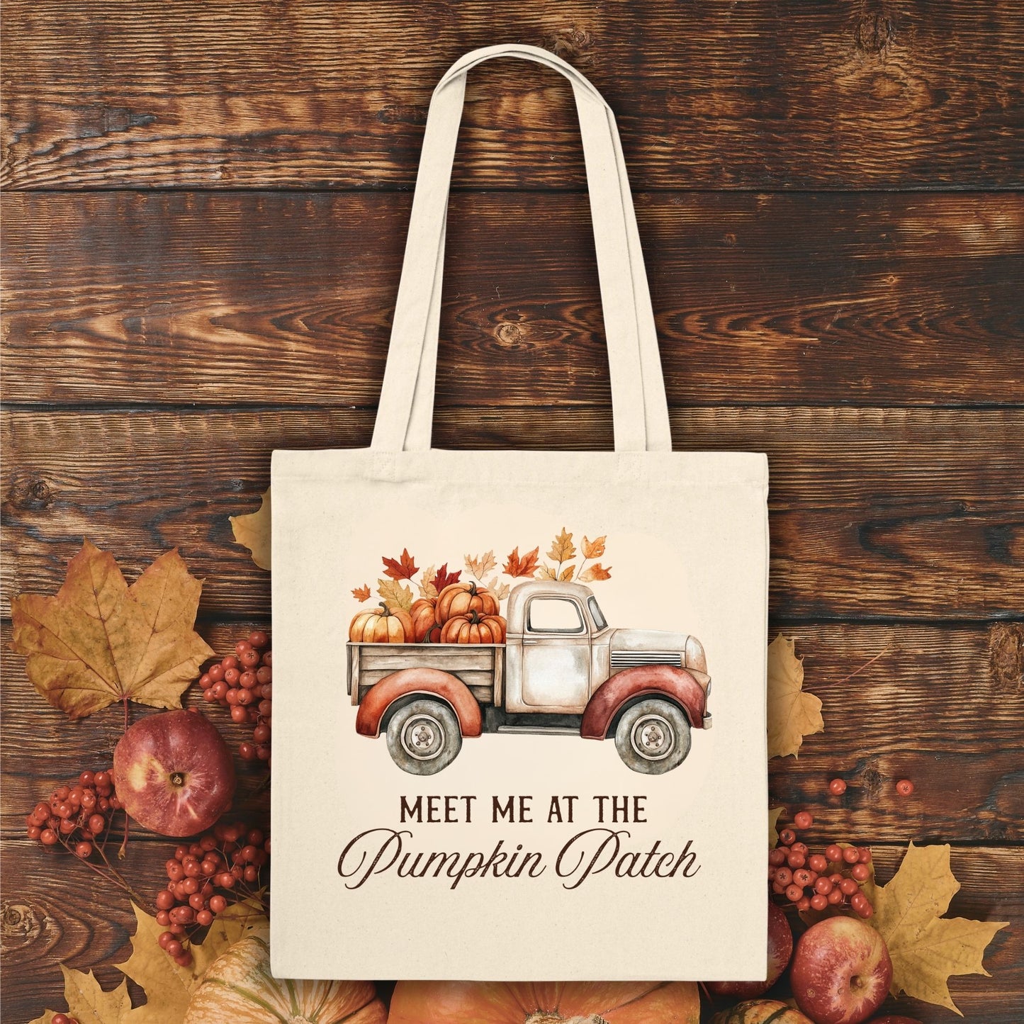 Natural canvas tote bag with vintage truck, pumpkins, fall leaves, and "Meet Me at the Pumpkin Patch" text.