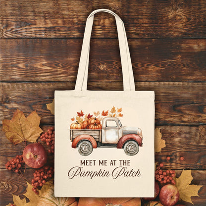 Natural canvas tote bag with vintage truck, pumpkins, fall leaves, and "Meet Me at the Pumpkin Patch" text.