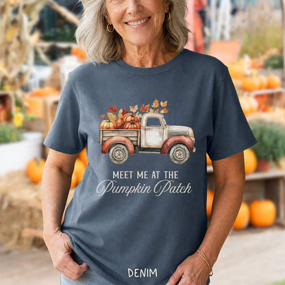 Denim blue cotton t-shirt featuring a watercolor vintage truck filled with pumpkins and autumn leaves, printed with fall text.