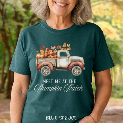 Blue spruce garment-dyed cotton t-shirt featuring a watercolor vintage truck filled with pumpkins and autumn leaves.