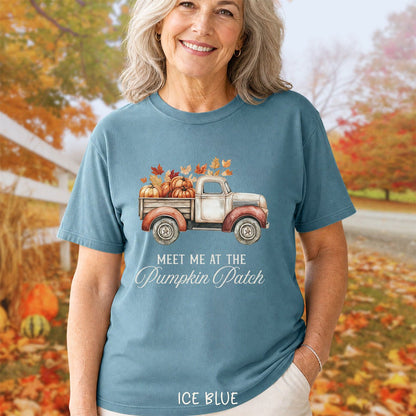 Ice blue garment-dyed cotton t-shirt featuring a watercolor vintage truck with pumpkins and autumn leaves graphic.