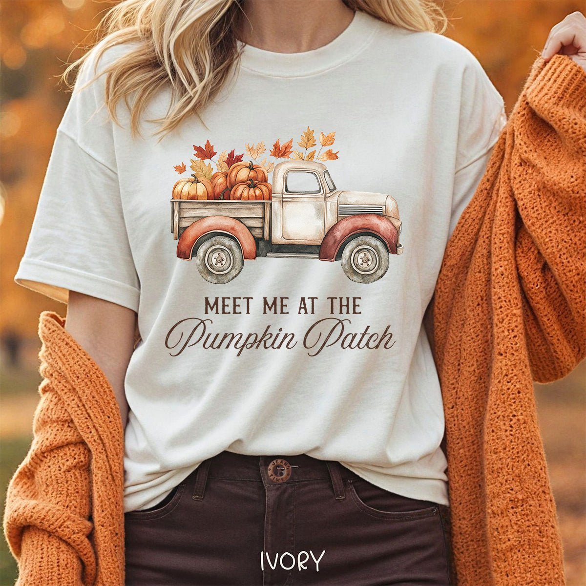 Ivory relaxed-fit cotton t-shirt featuring a watercolor vintage truck filled with pumpkins and autumn leaves.
