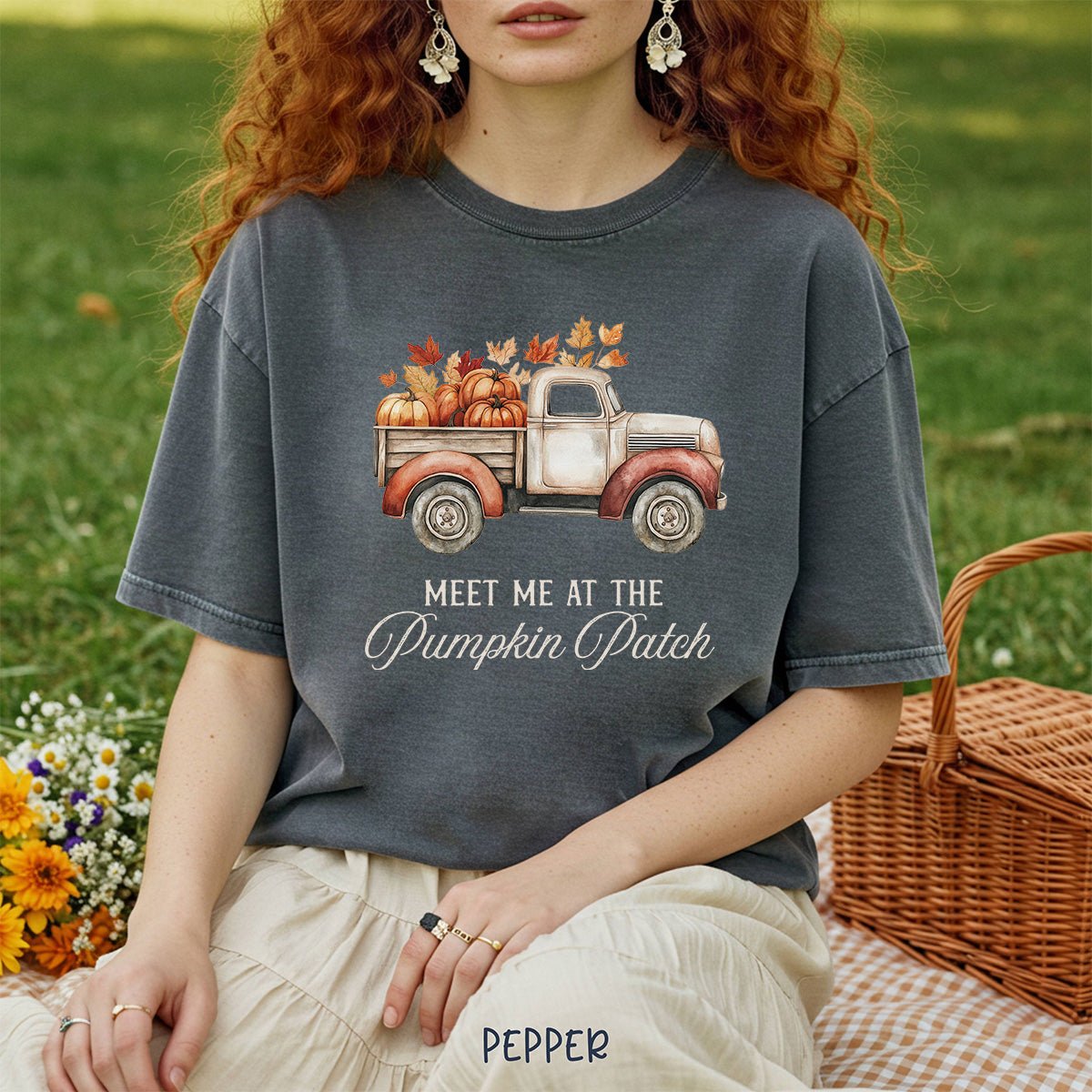 Charcoal garment-dyed cotton t-shirt featuring a watercolor vintage truck filled with pumpkins and autumn leaves.