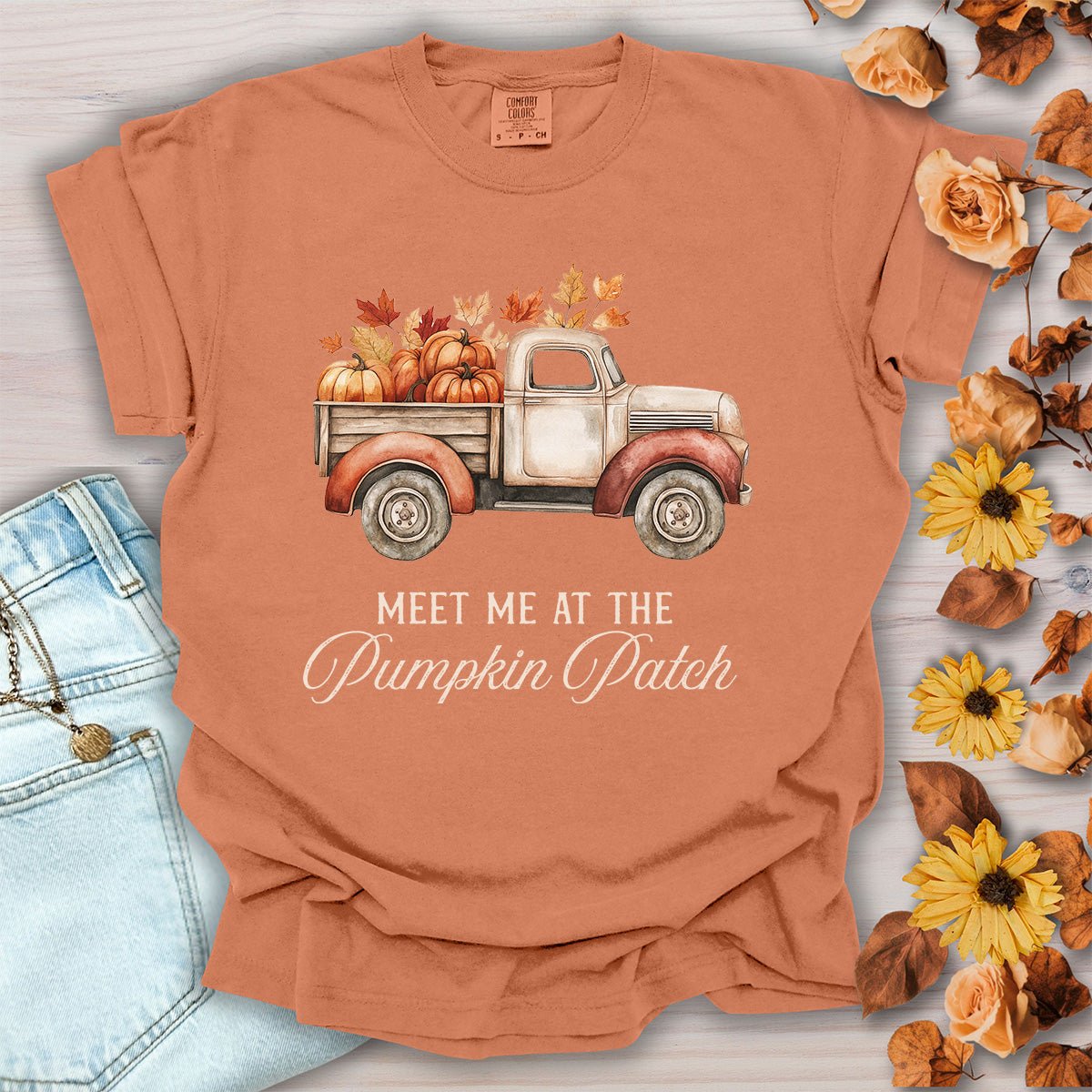 Yam-colored cotton t-shirt featuring a vintage truck with pumpkins and the text Meet Me at the Pumpkin Patch, size small.