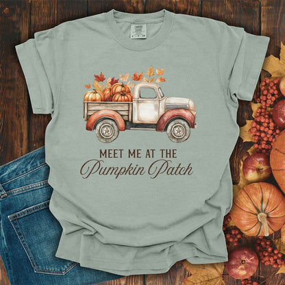Bay-colored, garment-dyed cotton t-shirt featuring a watercolor vintage truck with pumpkins and autumn leaves.