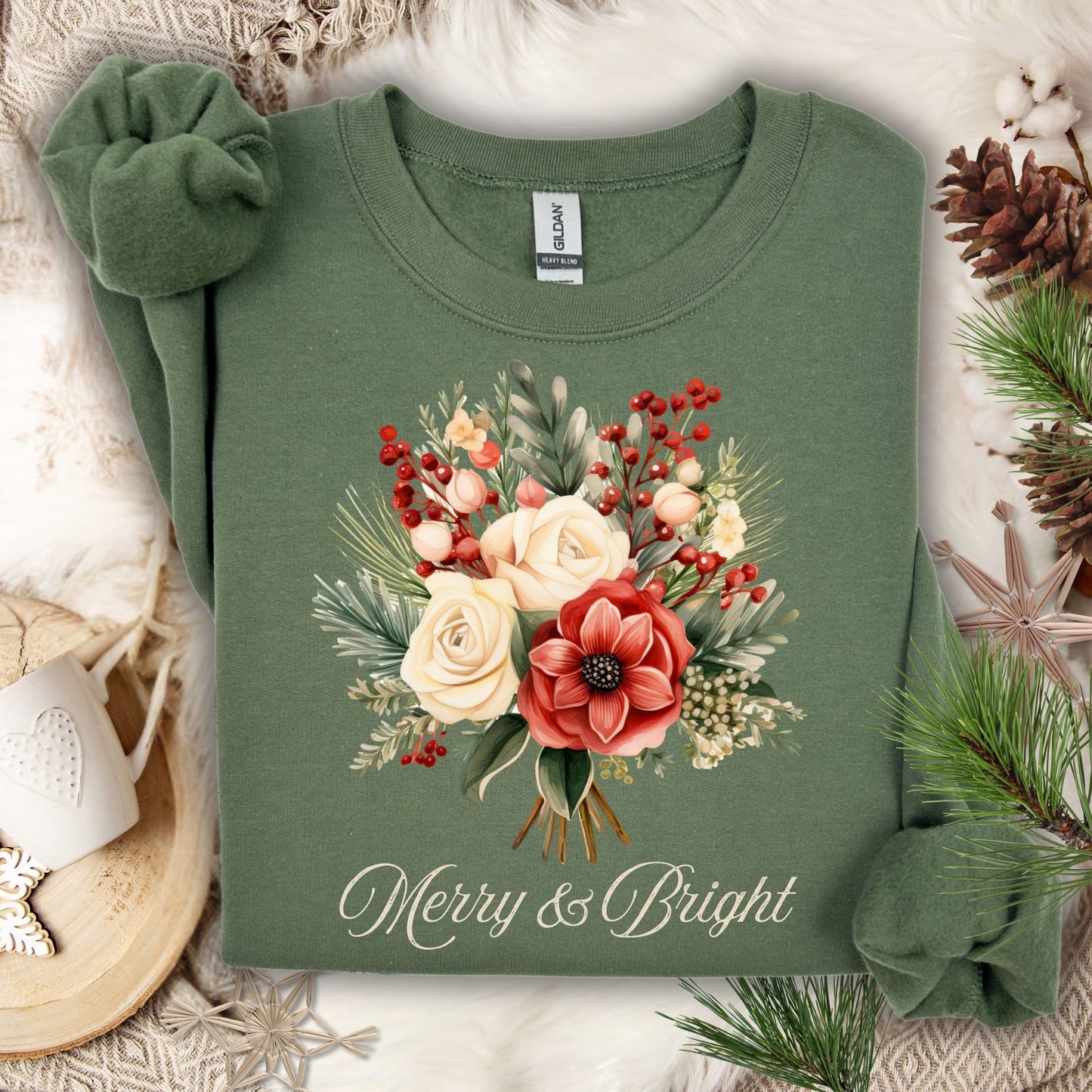 Military Green Gildan sweatshirt with vintage poinsettia, white rose bouquet, and "Merry & Bright" text.