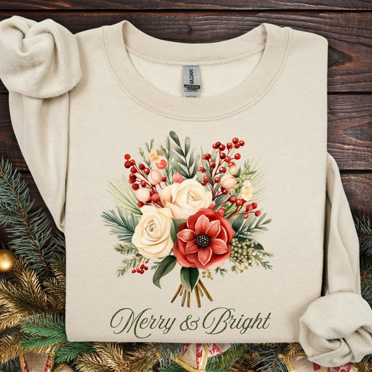 Sand Gildan sweatshirt with vintage poinsettia, white rose bouquet, and "Merry & Bright" text.