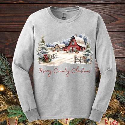 Ash gray long sleeve tee with a red barn, snowy trees, and "Merry Country Christmas" text.