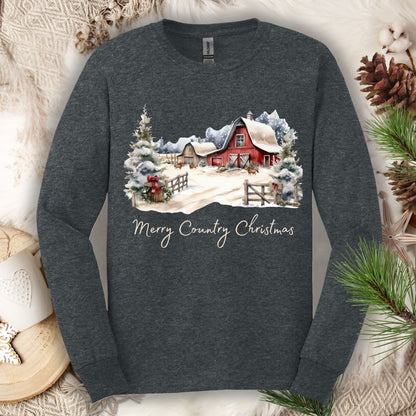 Dark Heather long sleeve tee with a snowy red barn, pine trees, and "Merry Country Christmas" text.