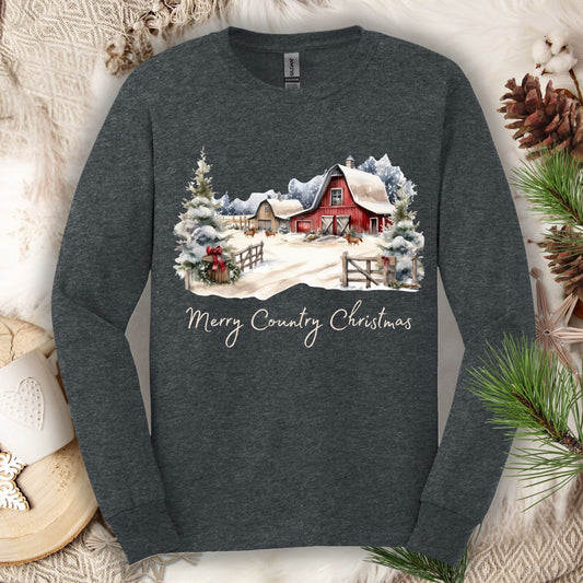 Dark Heather long sleeve tee with a snowy red barn, pine trees, and "Merry Country Christmas" text.