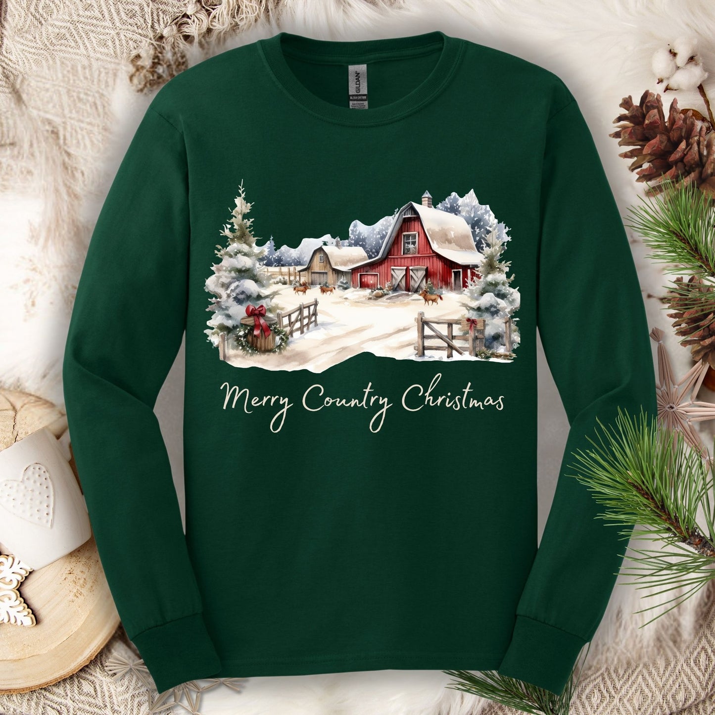 Forest Green long sleeve tee with a snowy red barn, pine trees, and "Merry Country Christmas" text.