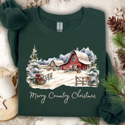 Forest Green Gildan sweatshirt with a watercolor snow-covered red barn, evergreens, and "Merry Country Christmas" text.