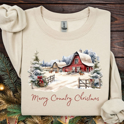 Sand Gildan sweatshirt with a watercolor red barn, snow, trees, and "Merry Country Christmas" text.