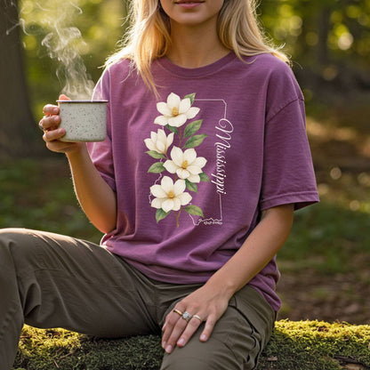 Relaxed-fit, garment-dyed plum t-shirt with a magnolia illustration and "Mississippi" text.