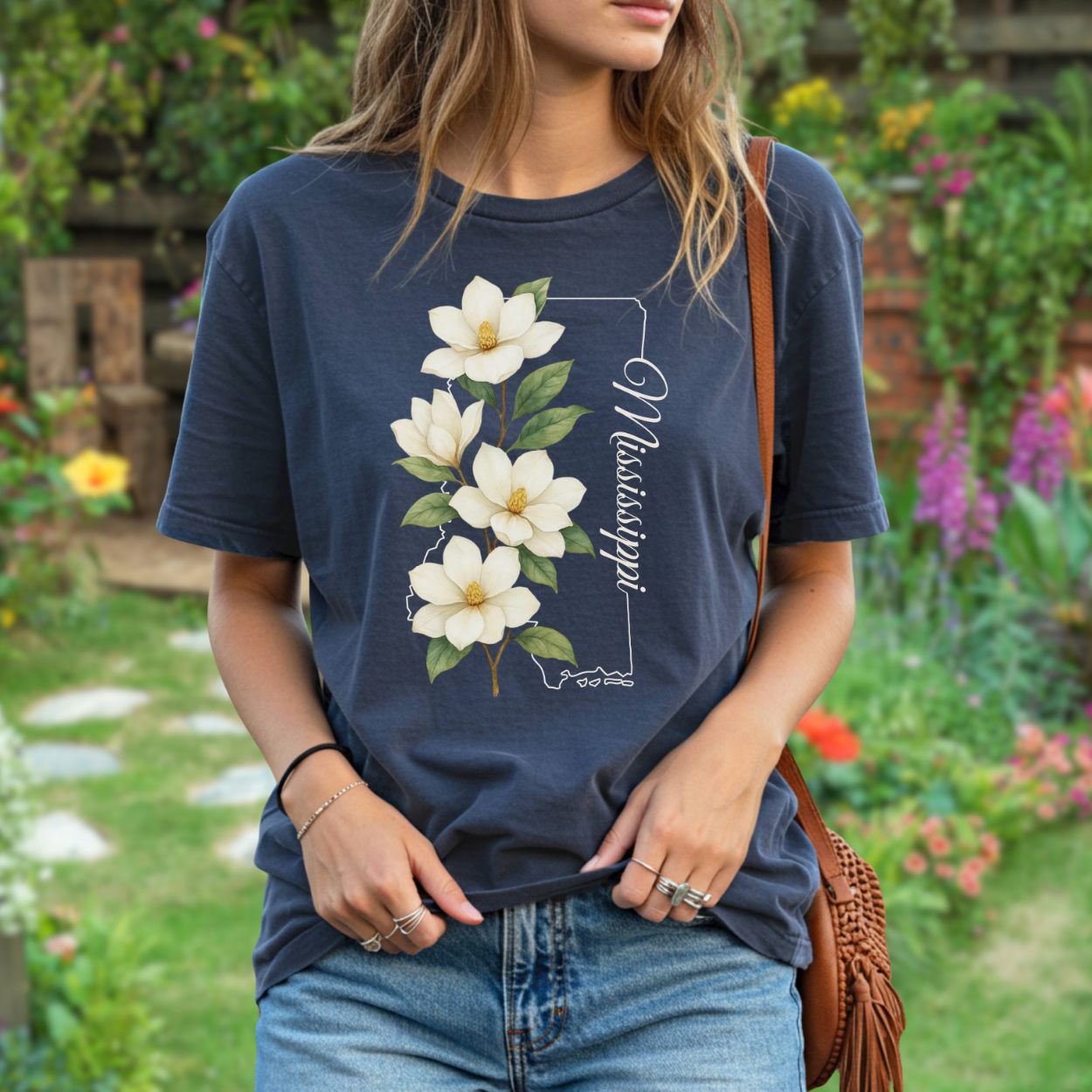Relaxed-fit, garment-dyed navy cotton t-shirt with a magnolia illustration and "Mississippi" text.